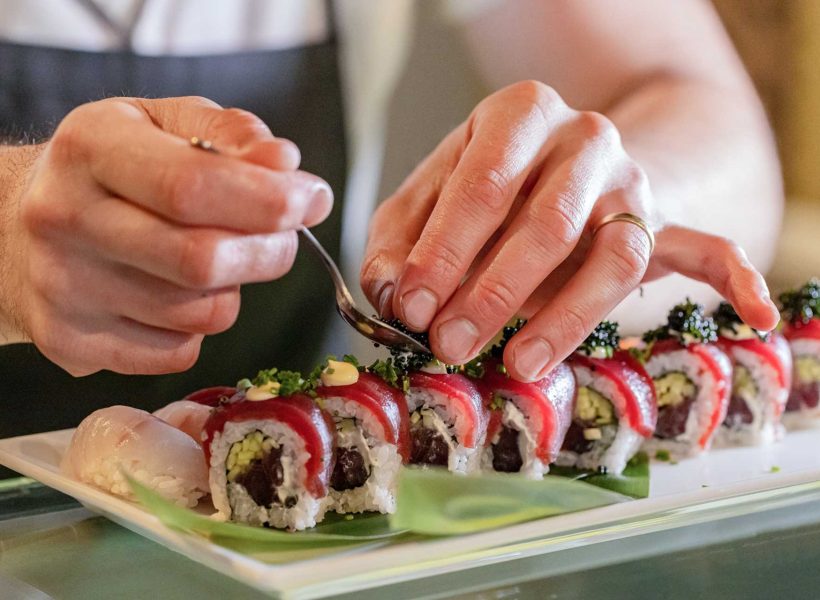 chef-s-hands-decorating-traditional-japanese-sushi-1.jpg